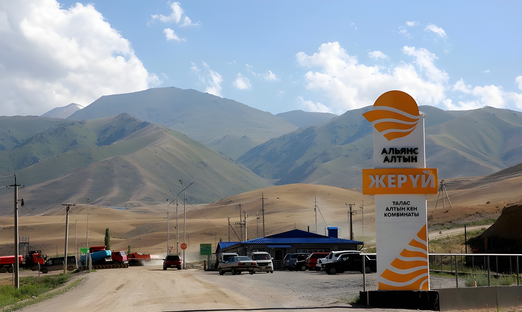 Entrance to the Jerooy production site against the mountains of the Talas Region